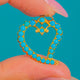 Georgian Era 9ct Gold Witches' Heart Turquoise Pendant, front view of the open Turquoise heart on blue