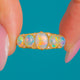 18ct Gold five-stone Opal ring, front of graduated Opals and Diamond spacers