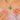 Close neckline view of the colourful cross pendant