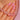 Faceted pink beads and clear spacers held at the neckline