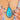 Pear-shaped butterfly wing pendant, close-up worn on a chain